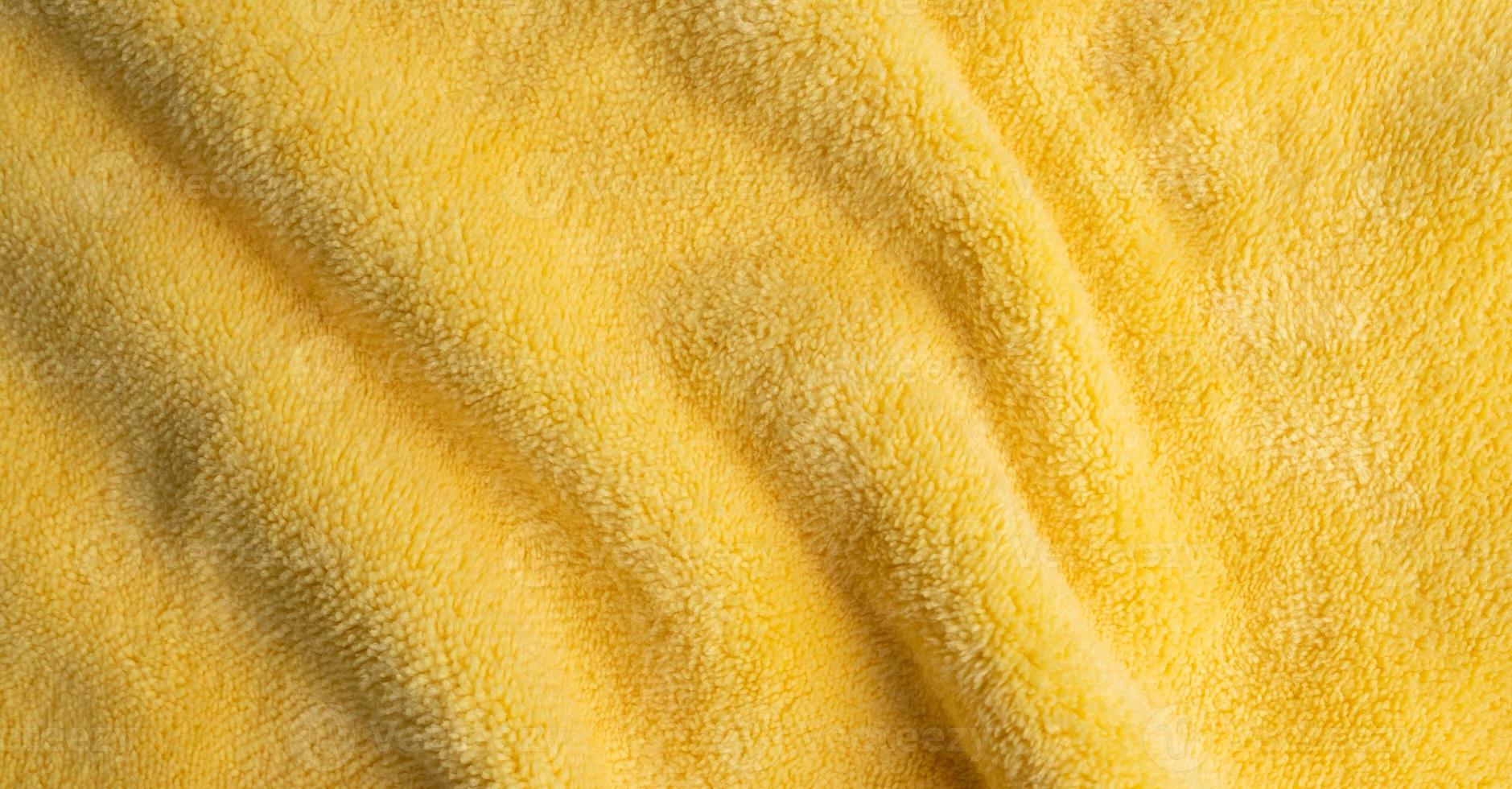 gelber Stoff Textur Hintergrund, abstrakt, Nahaufnahme Textur des Stoffes foto