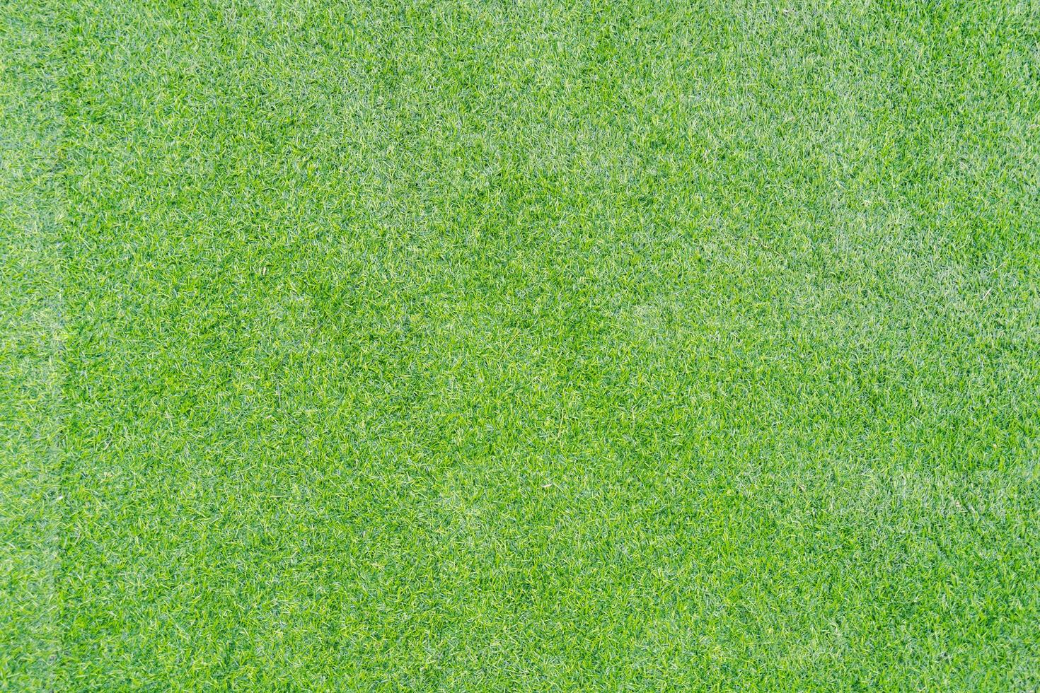 Draufsichtfoto, künstlicher grüner Grasbeschaffenheitshintergrund foto