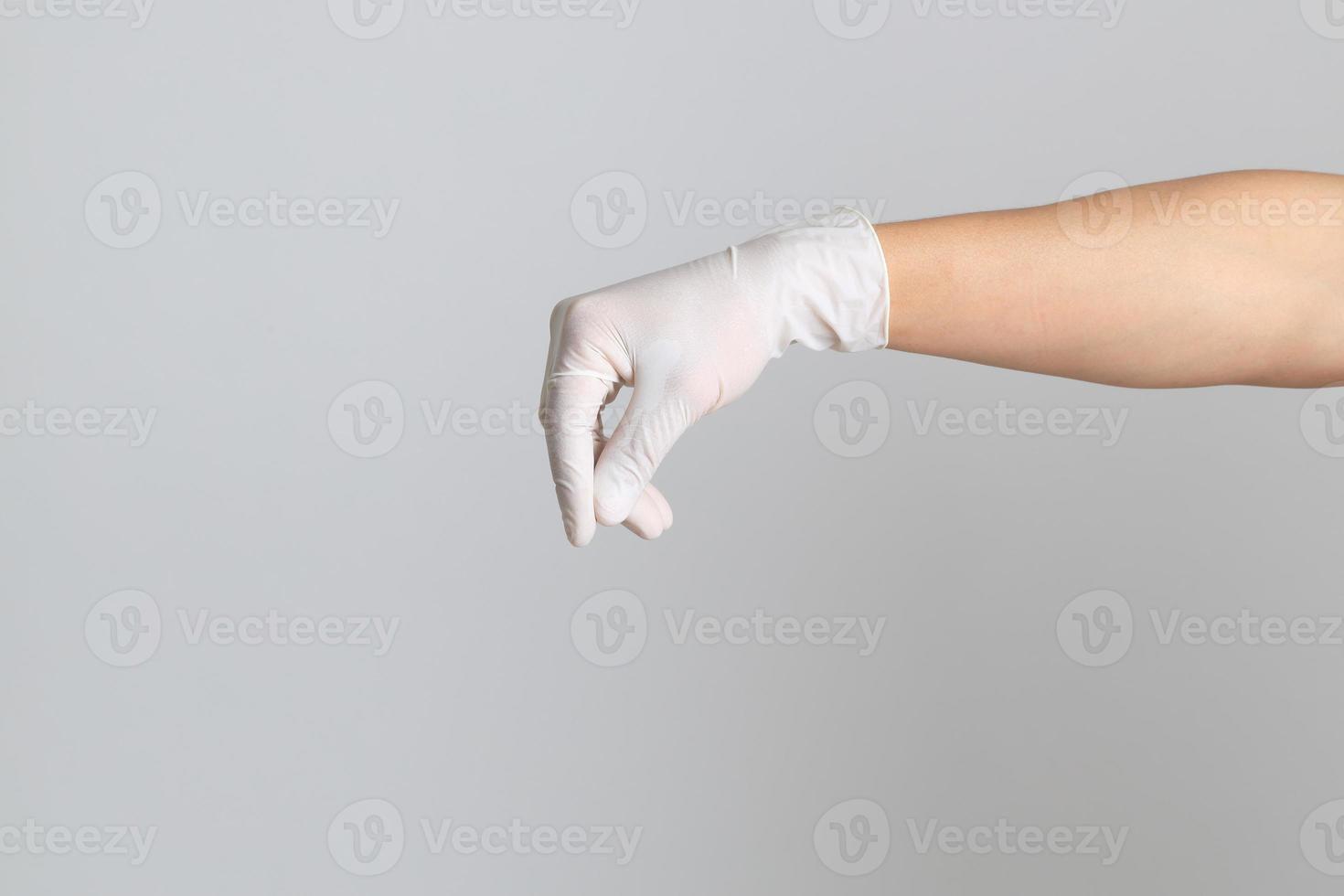 Hand mit medizinischen Handschuhen foto