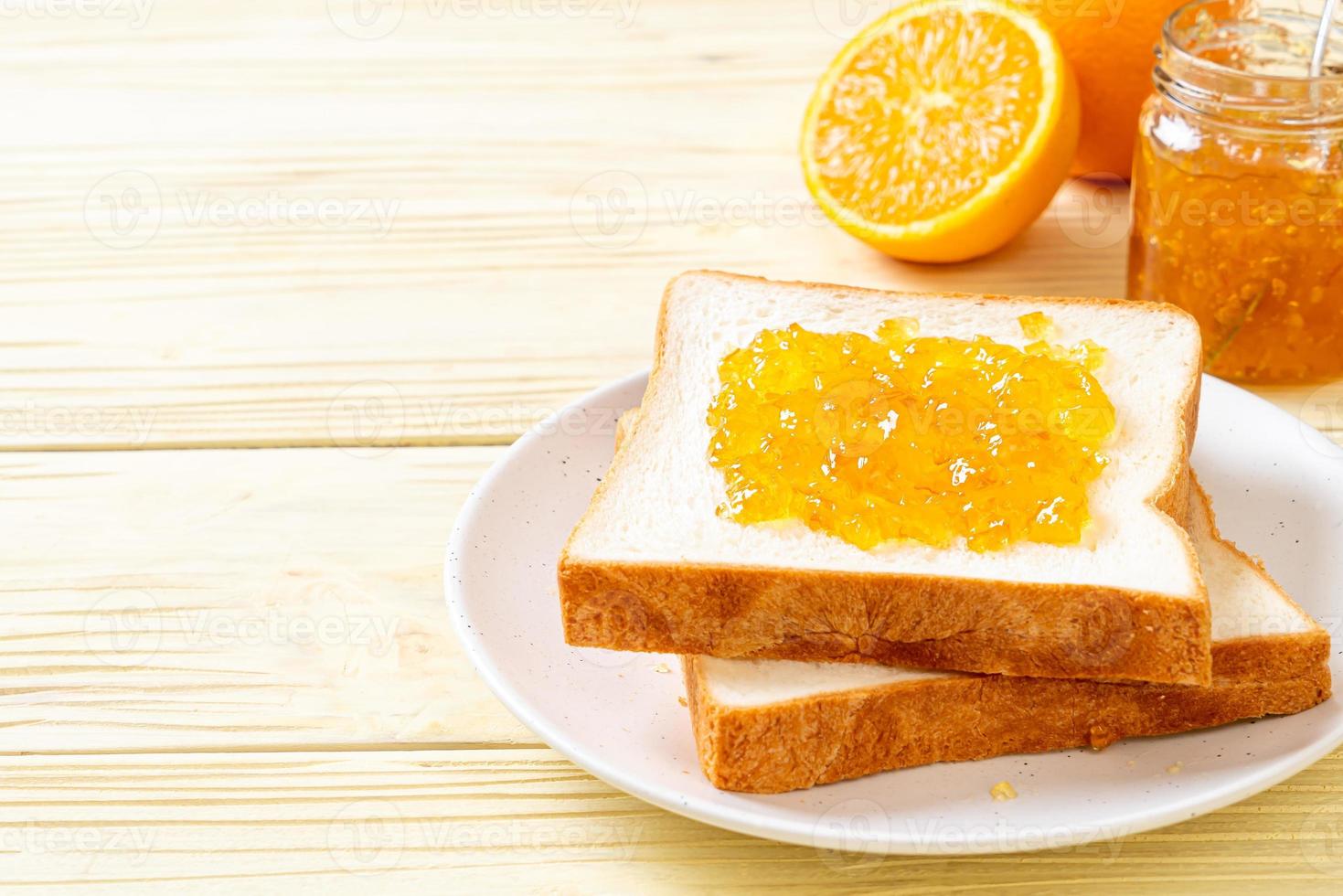 Brotscheiben mit Orangenmarmelade foto