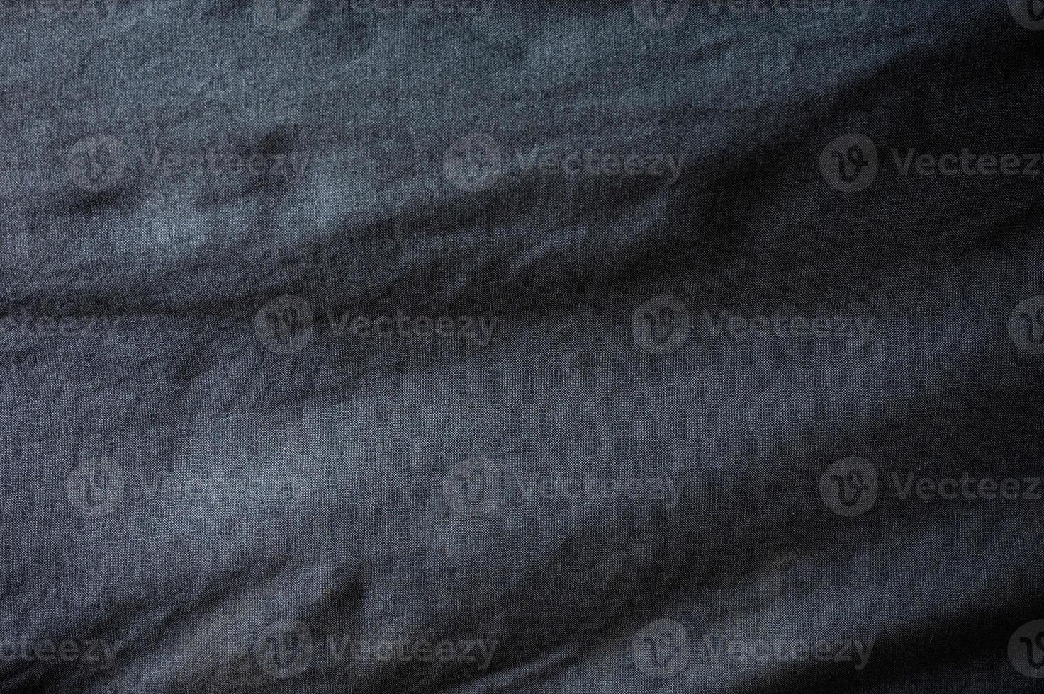 zerknittertes schwarzes Stoffsofa glänzende Textur foto