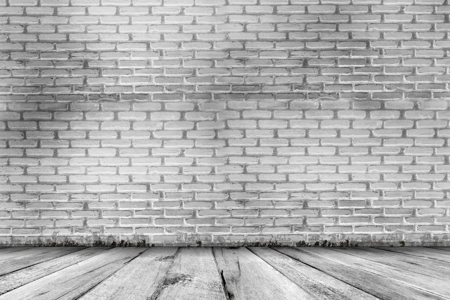 abstrakter Grunge-Textur-Hintergrund. leerer Raum mit Backsteinmauer und Holzboden foto