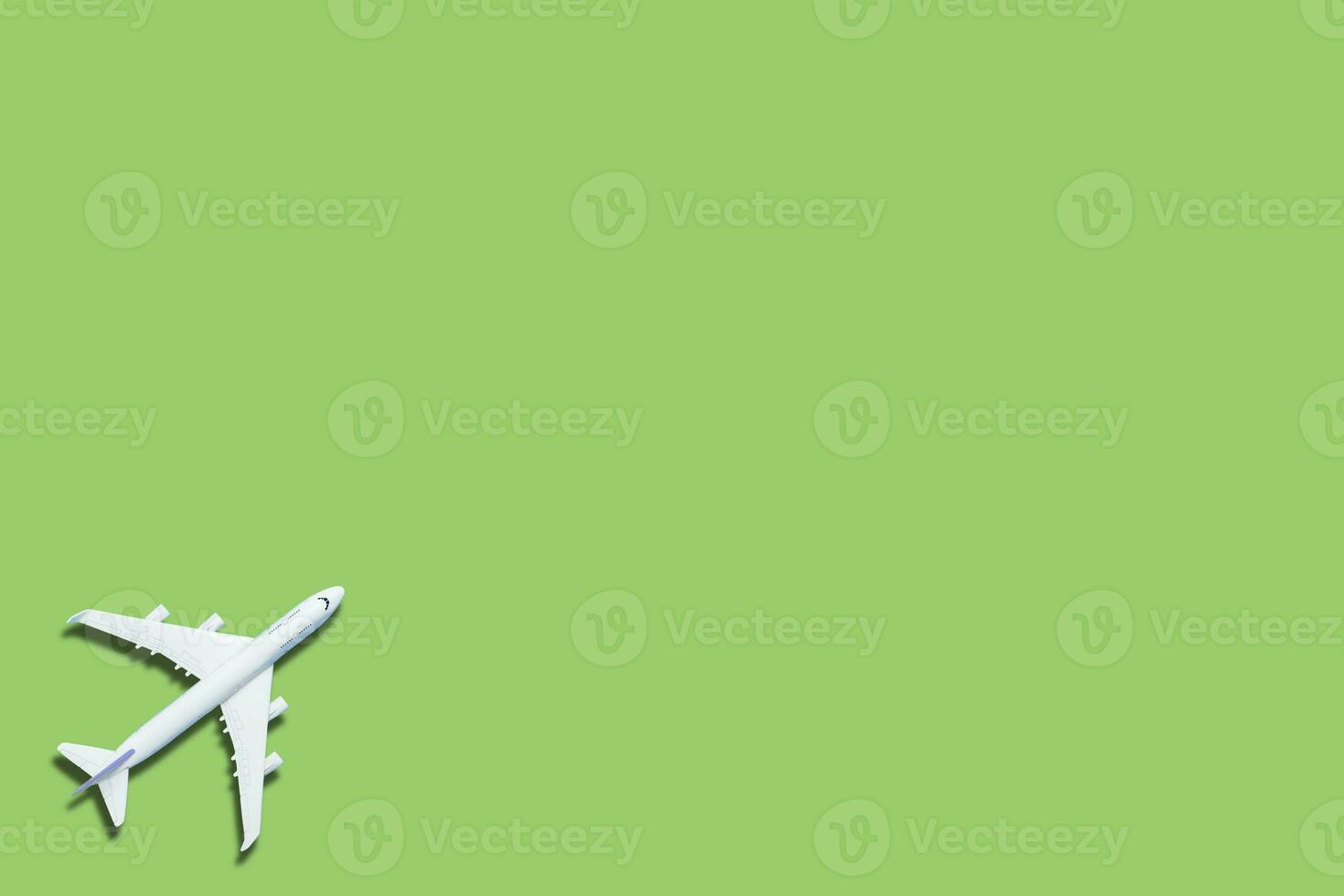 Modell- Flugzeug, Flugzeug auf Grün Farbe Hintergrund. foto