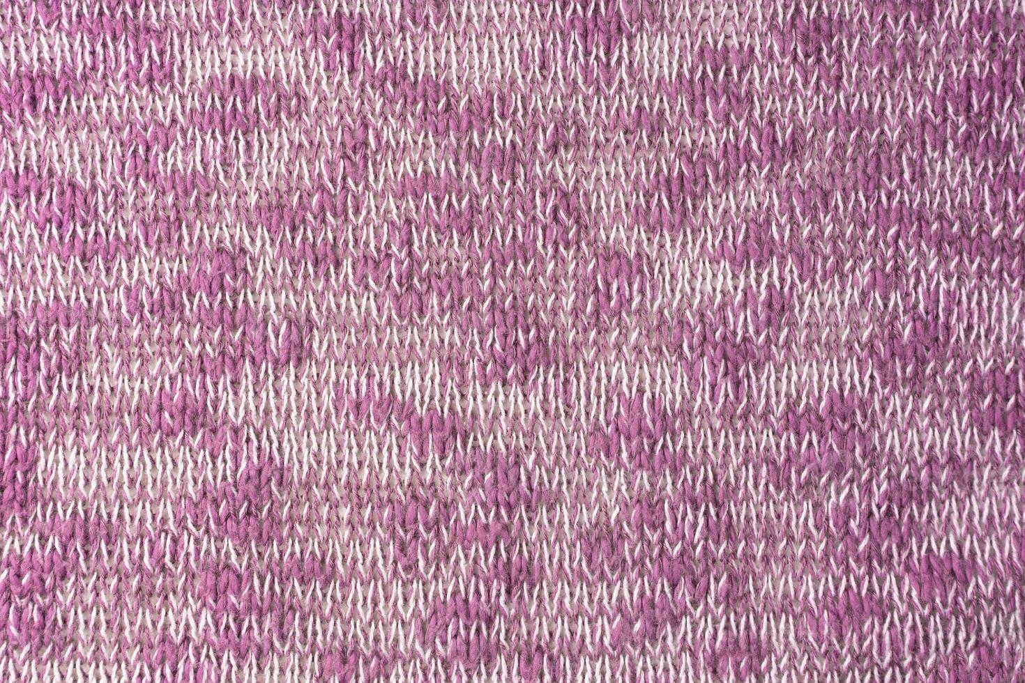 hell Rosa Weiß melange Strickwaren wolle Stoff Textur Hintergrund. abstrakt Textil- Hintergrund foto