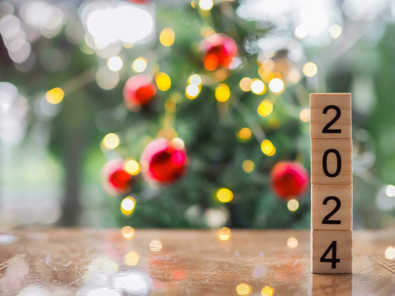 schließen oben von Nummer 2024 mit Weihnachten Licht Bokeh Hintergrund. fröhlich Weihnachten und glücklich Neu Jahr 2024 foto