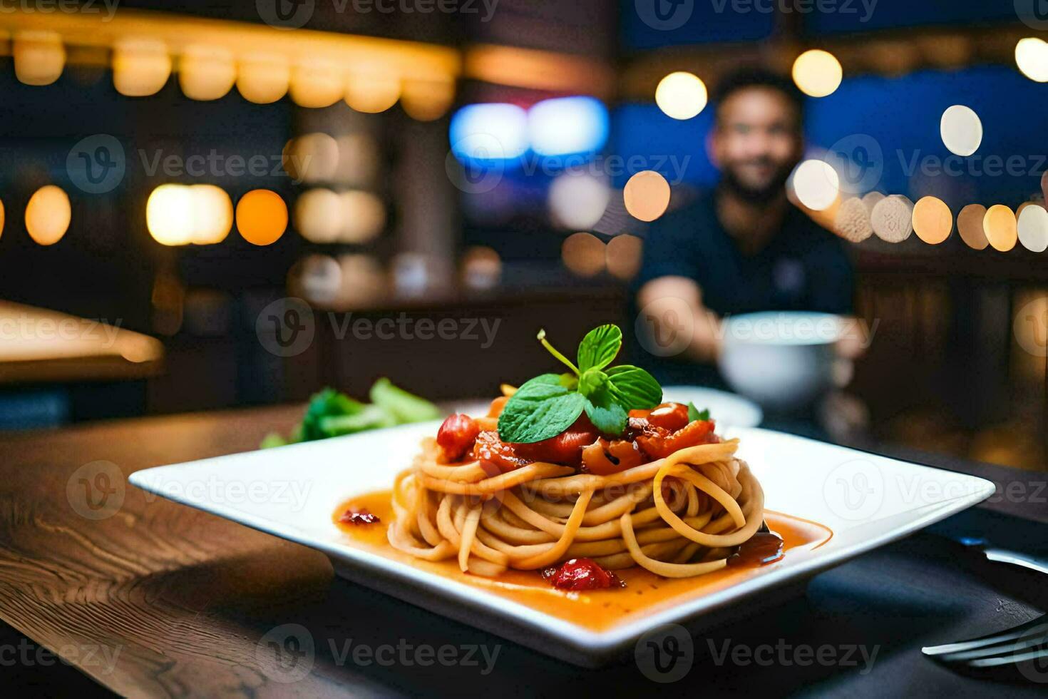 ein Mann ist Sitzung beim ein Tabelle mit ein Teller von Spaghetti. KI-generiert foto