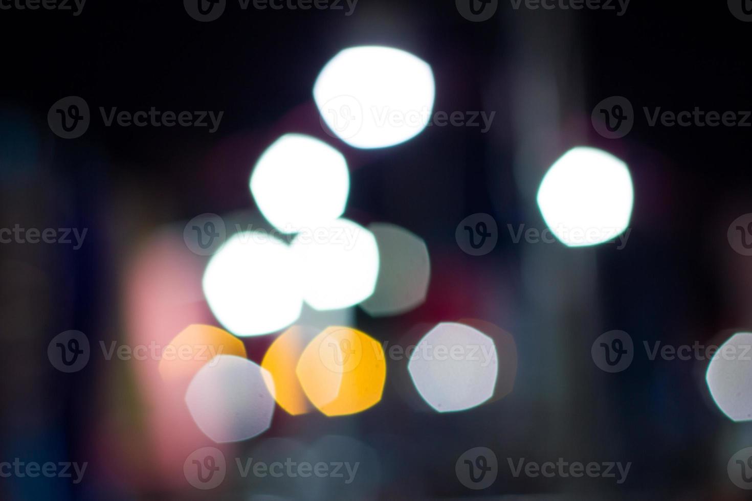 abstrakter kreisförmiger Bokeh-Hintergrund des Nachtlichts foto