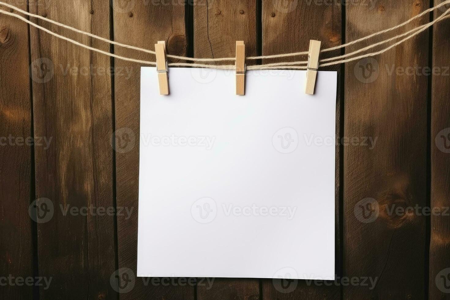 Weiß Blatt hängend auf ein Seil auf Wäscheklammern, hölzern Hintergrund, Platz zum Text. ai generiert foto