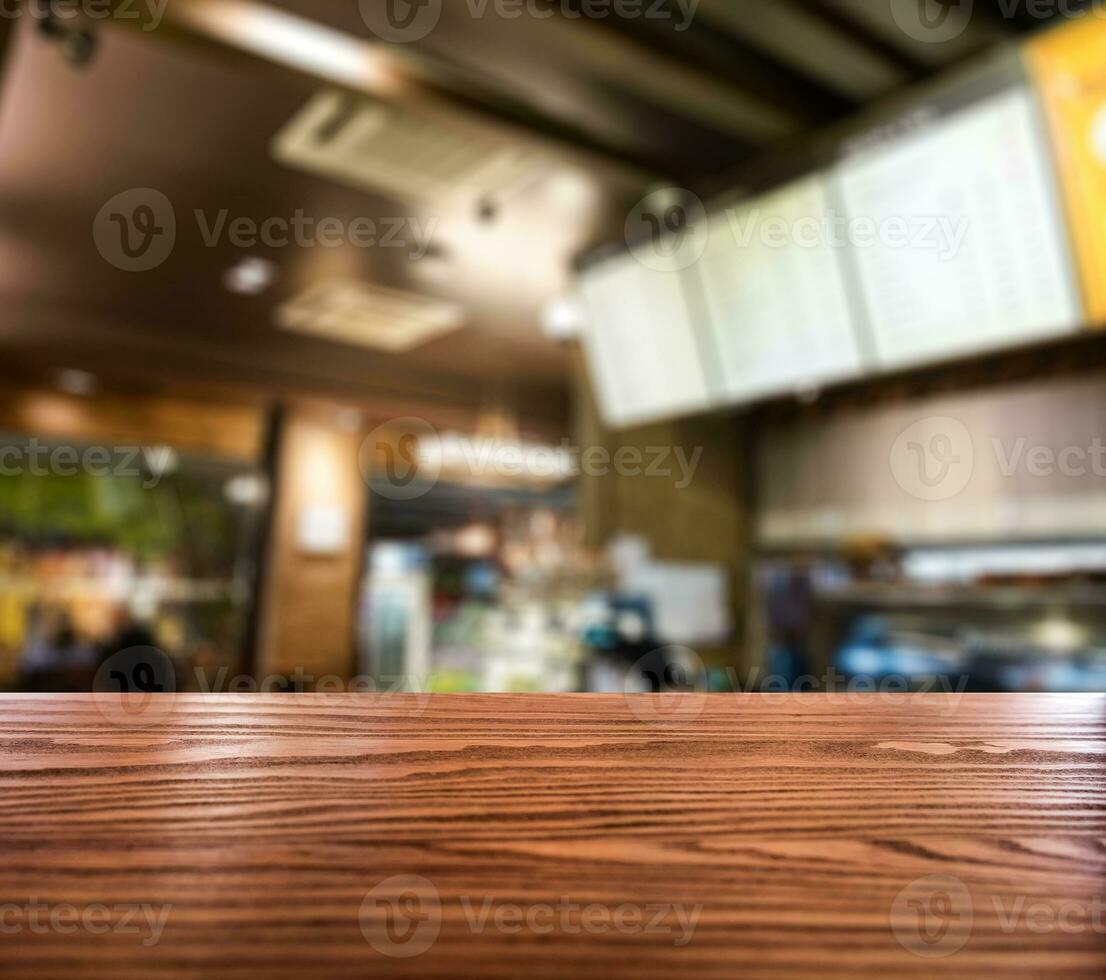 Holz Tabelle oben auf verschwommen Kaffee Cafe Jahrgang foto