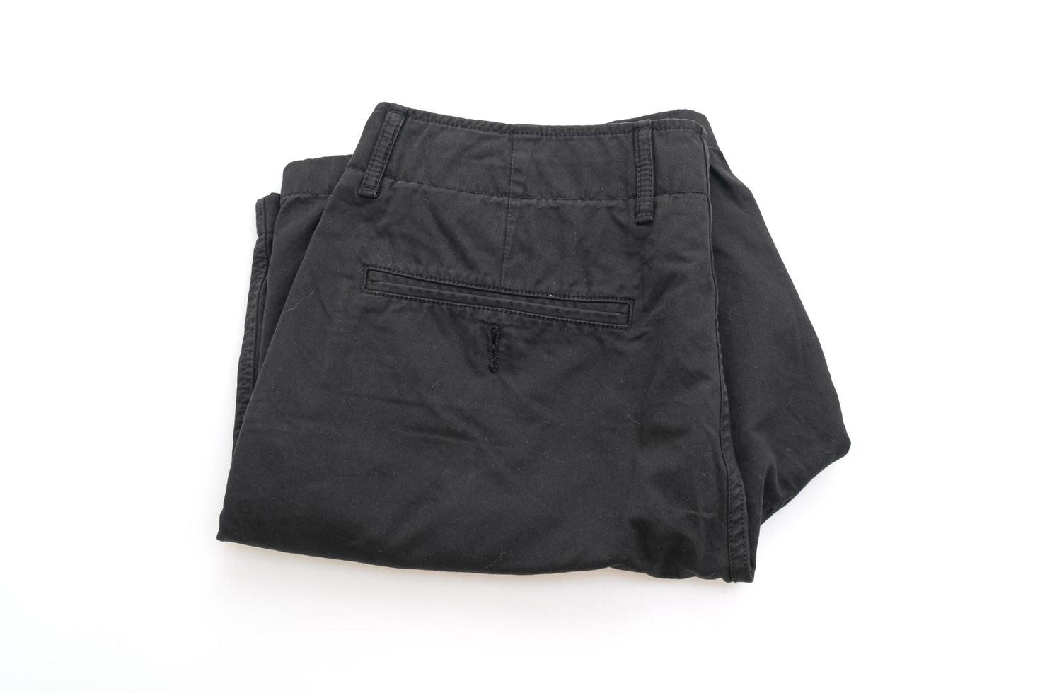 schwarze Shorts Hose gefaltet isoliert auf weißem Hintergrund foto