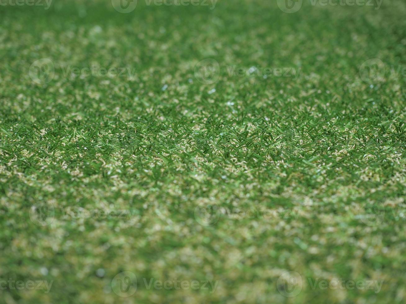 grüner künstlicher synthetischer graswiese hintergrund foto
