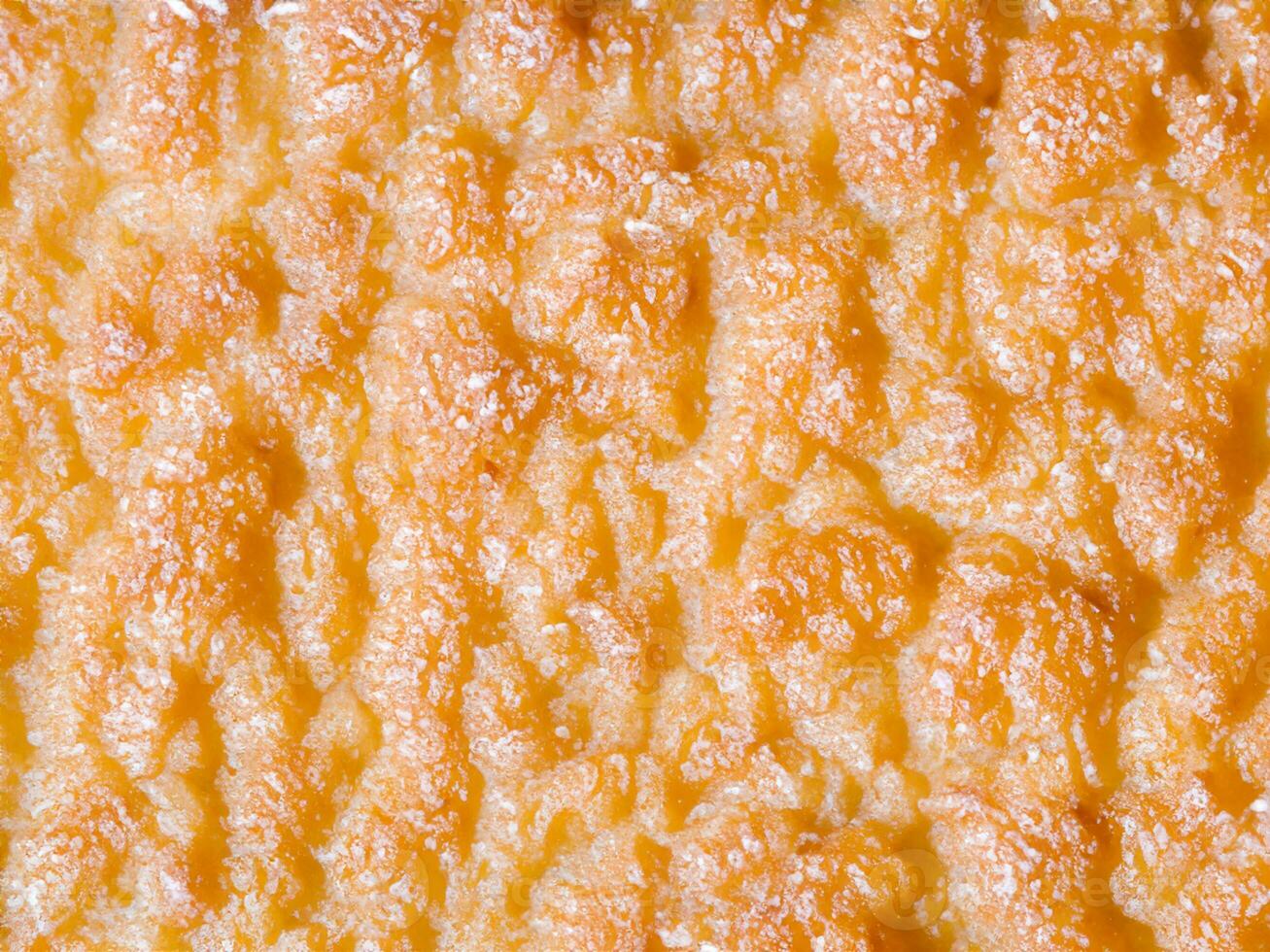 schließen oben von Orange Käse Hintergrund Textur. foto