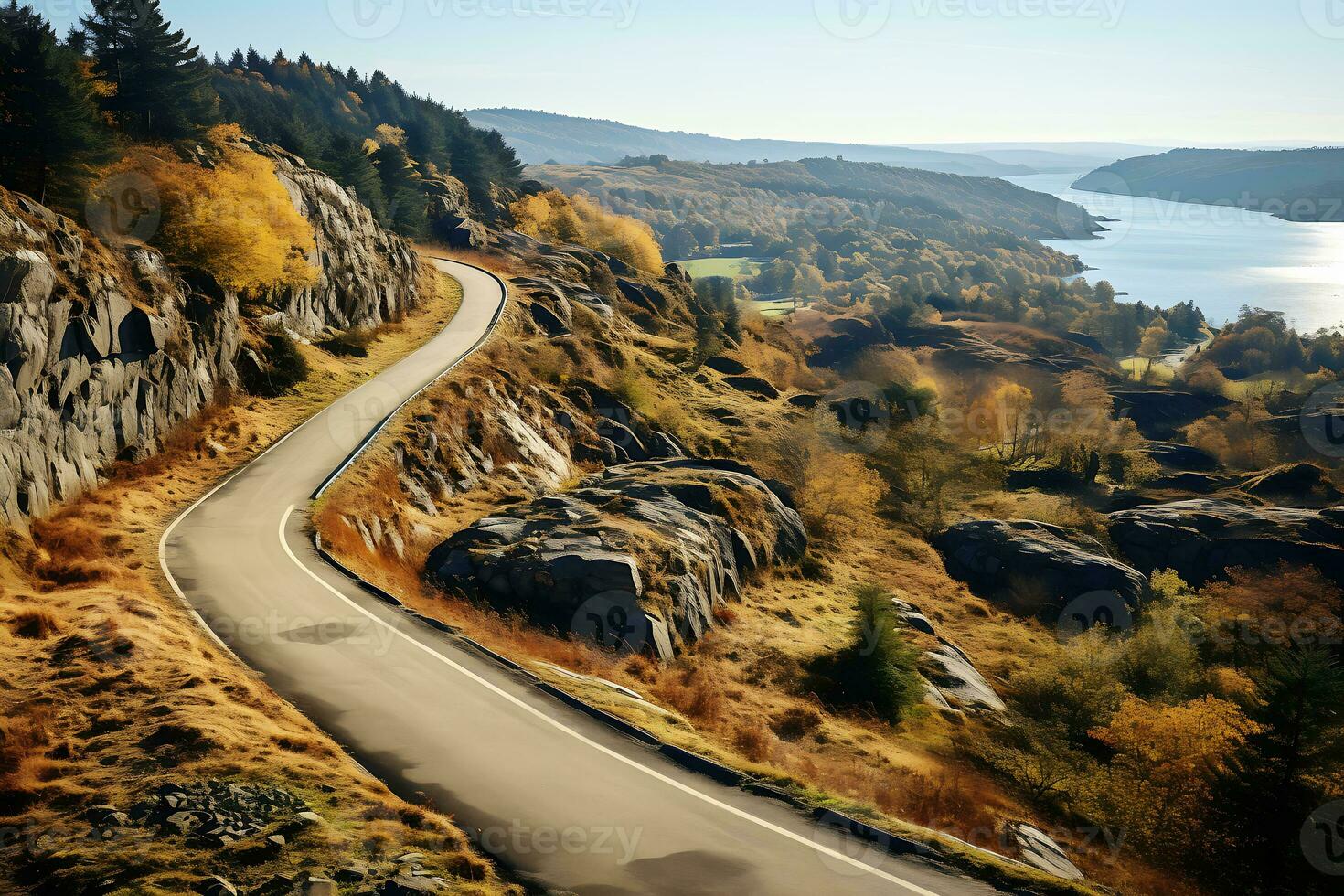 das Straße geht vorbei durch felsig Hügel, ein Fluss fließt im das Distanz. Herbst Landschaft. ai generativ foto