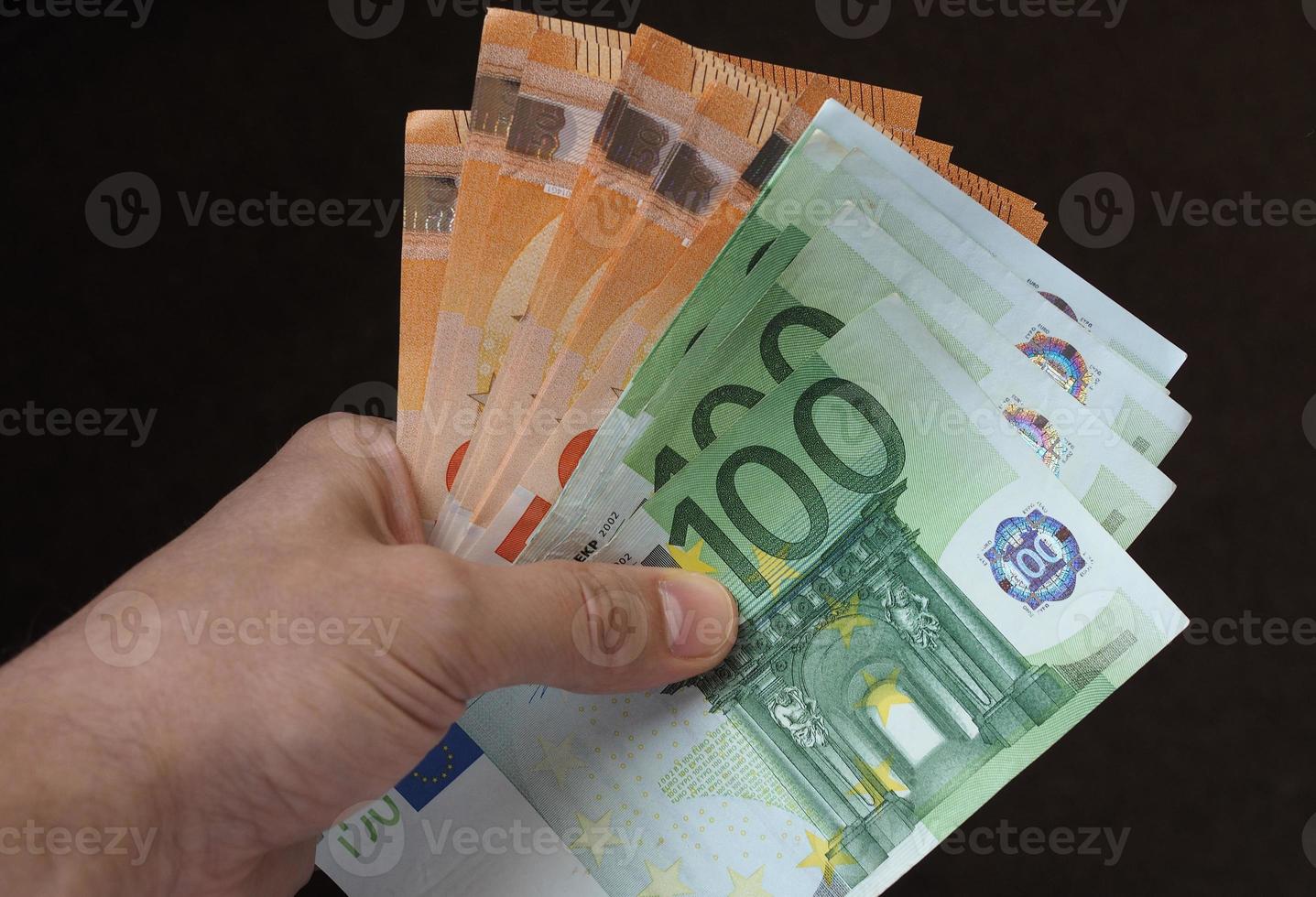 Hand mit Euro-Banknoten, Europäische Union foto