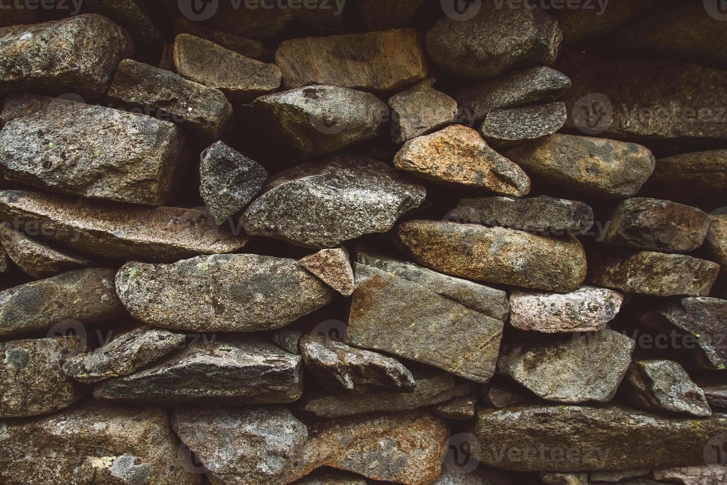 abstrakter Hintergrund der Steinmauerbeschaffenheit foto