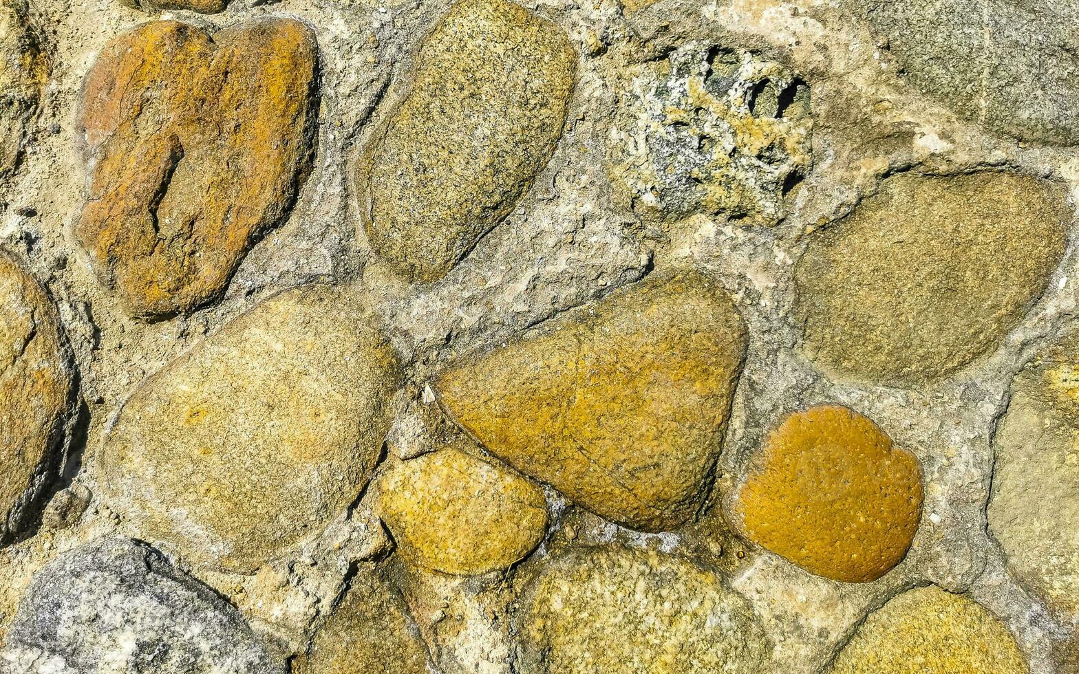 Textur Detail von Mauer mit Felsen Steine Backstein Ziegel Mexiko. foto