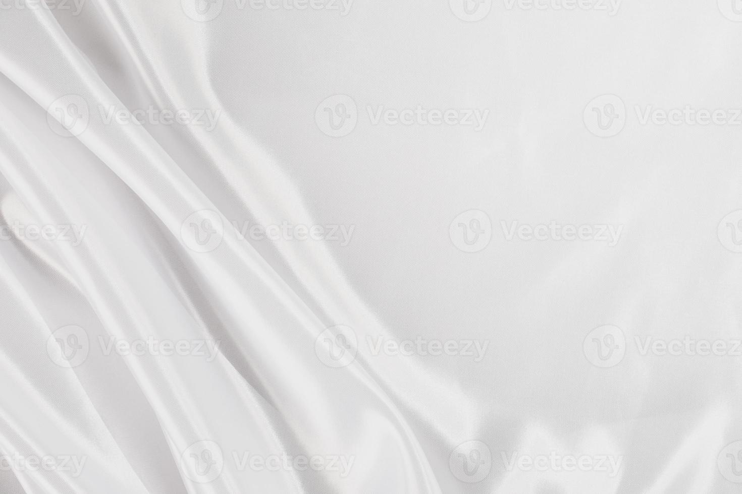abstraktes weißes seidiges Satintuch für den Hintergrund foto