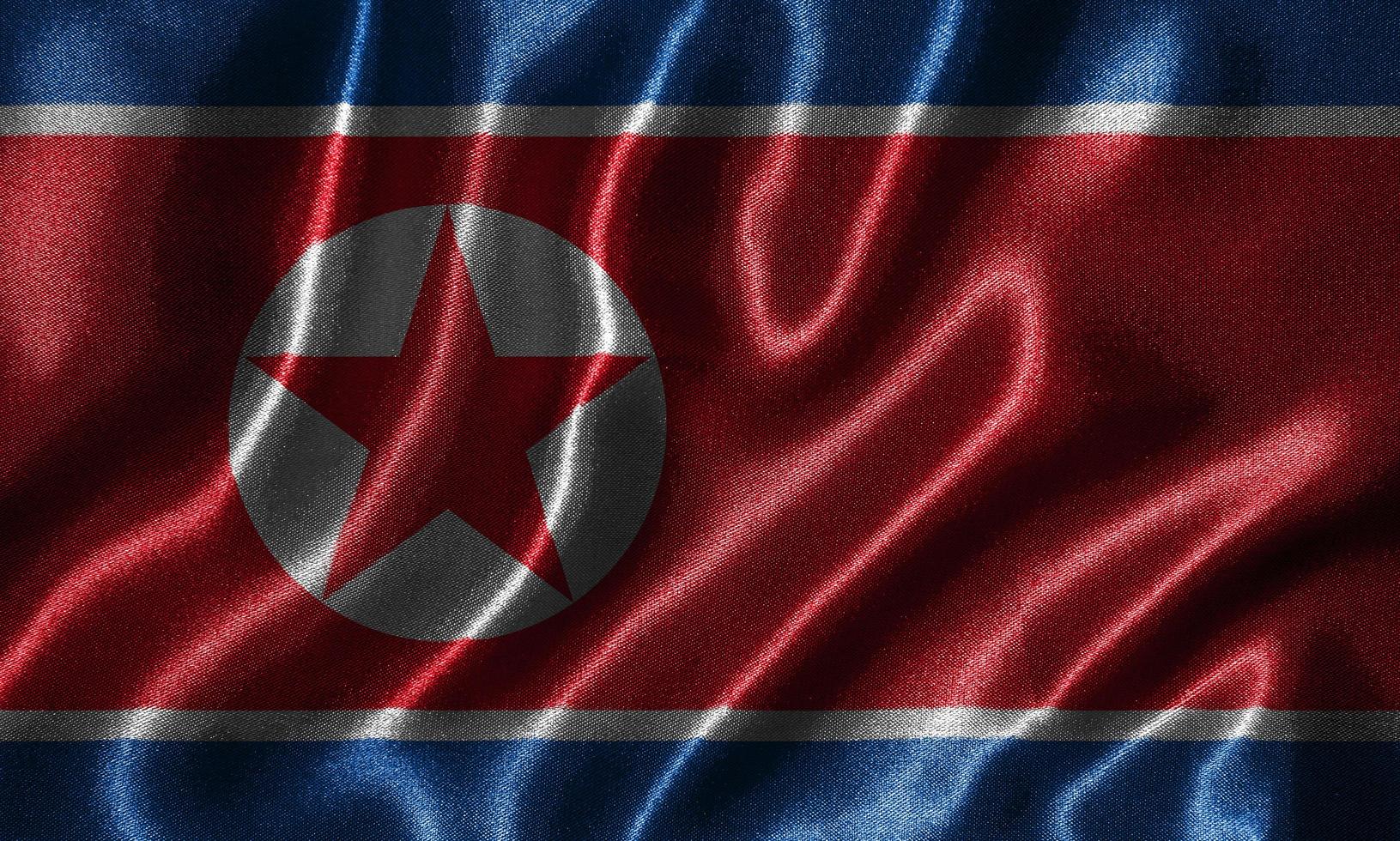 Tapete von Nordkorea-Flagge und wehende Flagge von Stoff. foto
