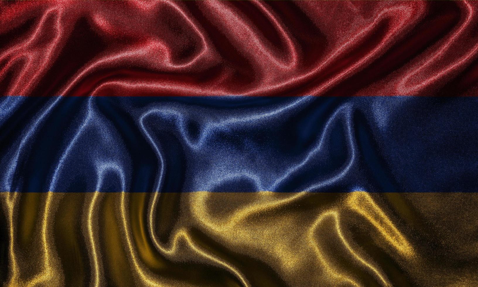 Tapete von Armenien-Flagge und wehende Flagge von Stoff. foto