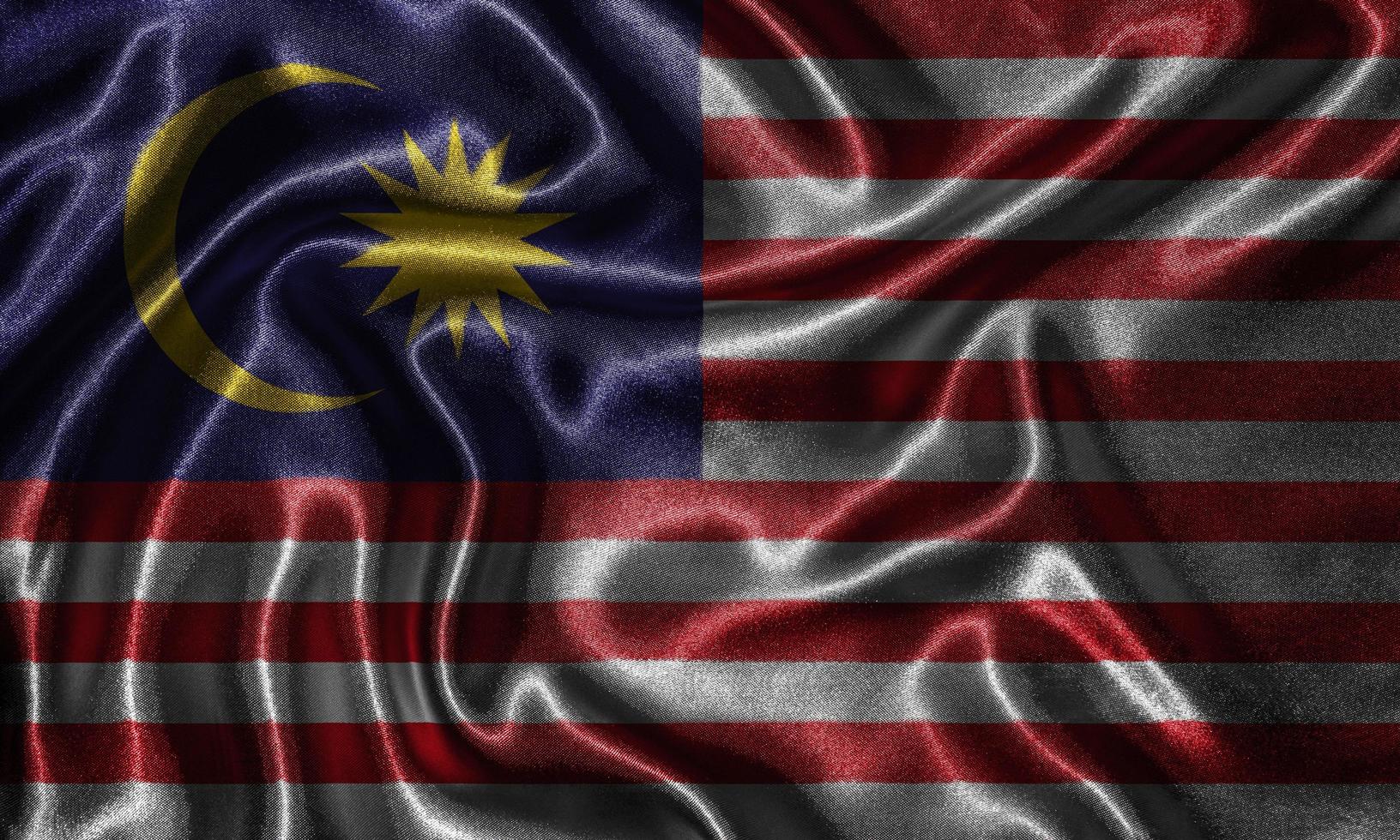 Tapete von Malaysia-Flagge und wehende Flagge von Stoff. foto