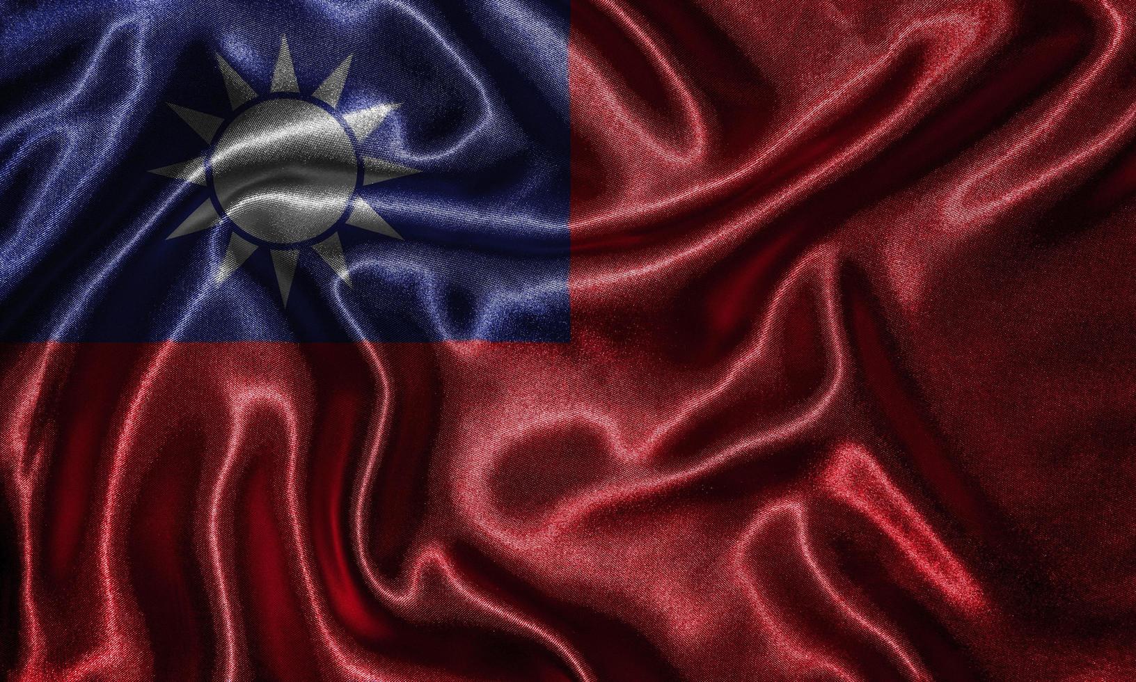 Tapete von Taiwan-Flagge und wehende Flagge von Stoff. foto