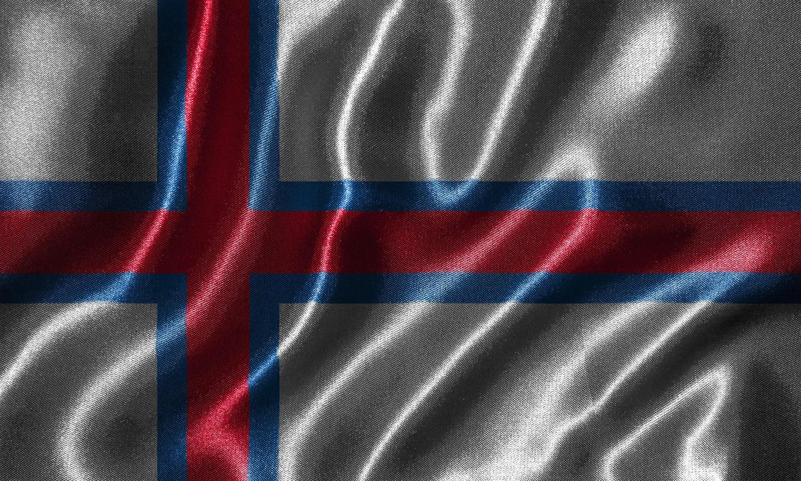 Tapete von Färöer-Flagge und wehende Flagge von Stoff. foto
