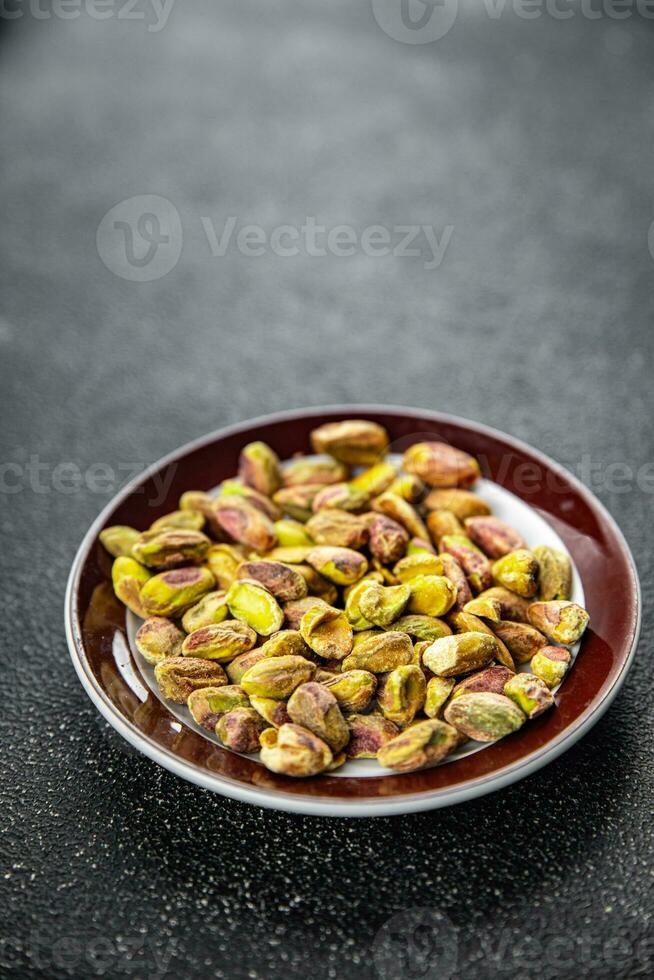 Pistazie geschält Nuss gesund Essen Kochen Vorspeise Mahlzeit Essen Snack auf das Tabelle Kopieren Raum Essen foto