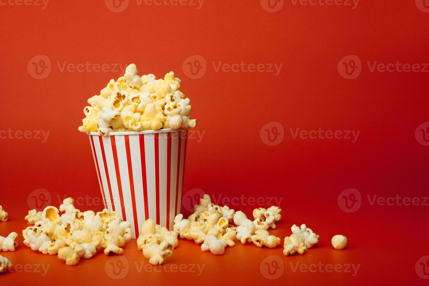 Popcorn im gestreift Papier Tasse mit Farbe Hintergrund zum Copyspace ai generativ foto