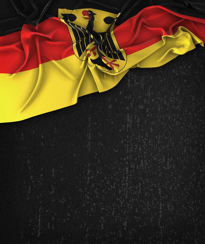 Deutschland Flagge Vintage auf einer schwarzen Grunge-Tafel foto