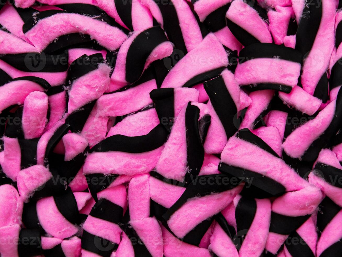 Rosa und schwarz Marshmallows oder Baumwolle Süßigkeiten Hintergrund foto