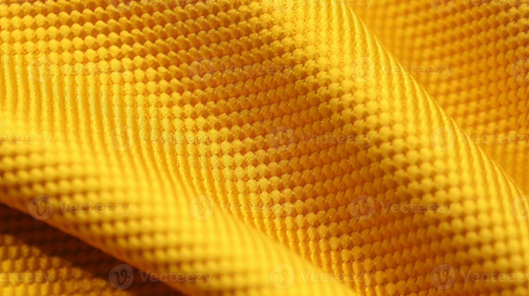 Gelb Fußball Jersey mit Luft Gittergewebe Textur. sportlich tragen Hintergrund foto