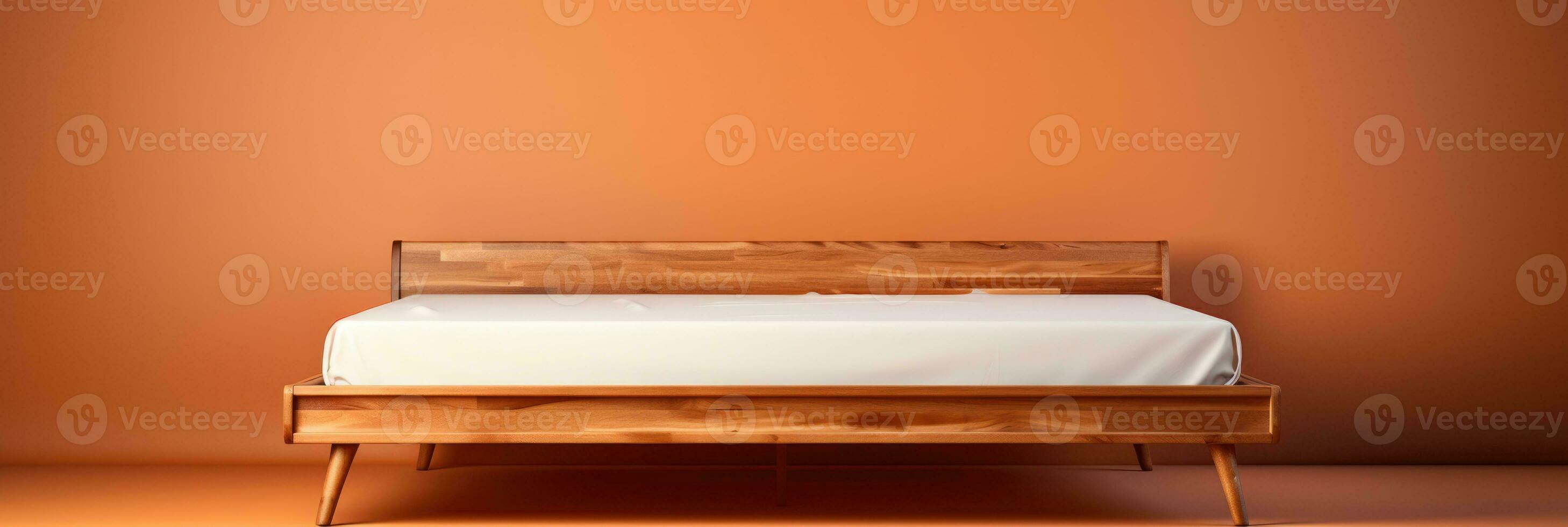 ein sauber minimalistisch hölzern Bett Rahmen isoliert auf ein braun Gradient Hintergrund foto