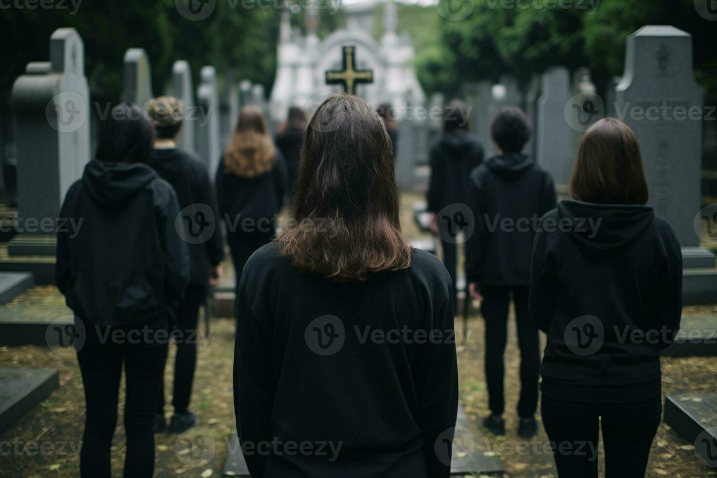 ein Gruppe von jung Menschen im ein Friedhof suchen beim das Grabsteine ai generiert foto