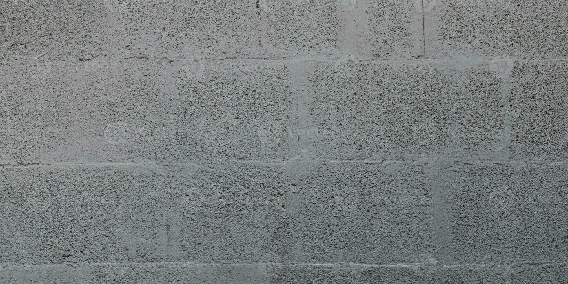 grau Betonblock Backstein Mauer zum Hintergrund grau Blockarbeit Textur foto