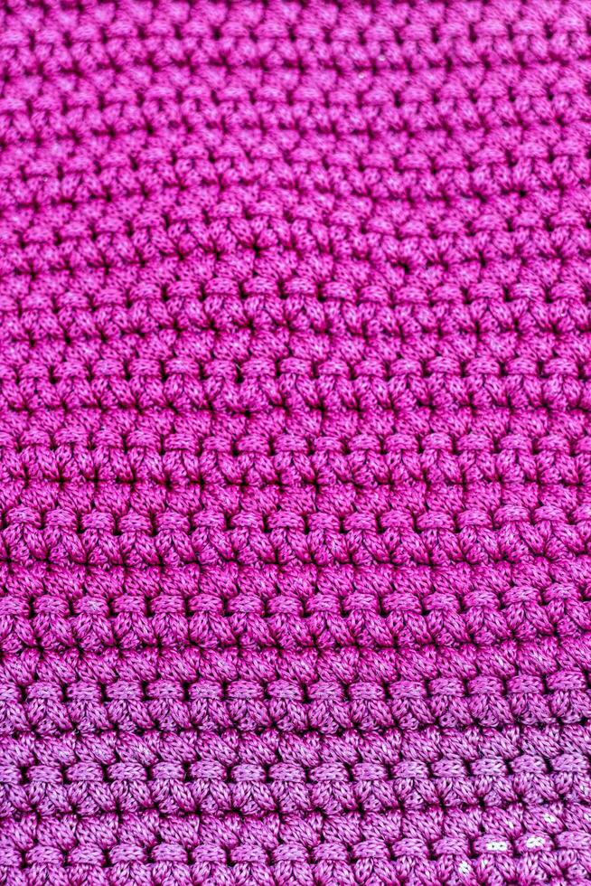 Rosa gestrickt Stoff wie ein Hintergrund. Nahansicht. Textur foto