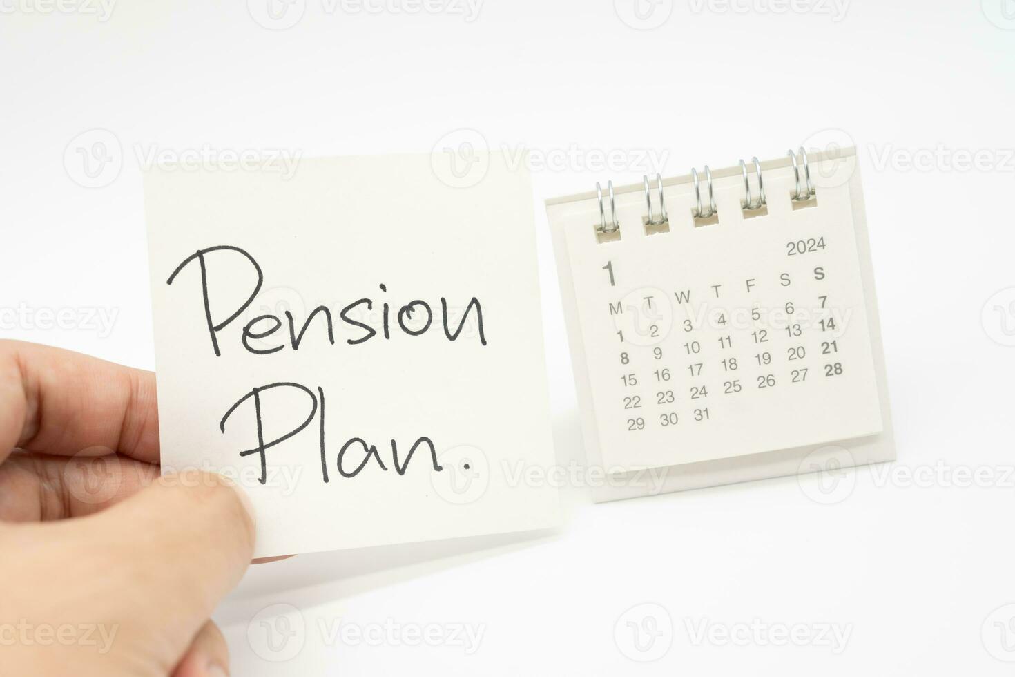 Schreibtisch Kalender und die Pension planen Hinweis Papier isoliert auf Weiß Hintergrund. zum Ruhestand, die Pension planen Konzept. zuletzt Datum von arbeiten. foto