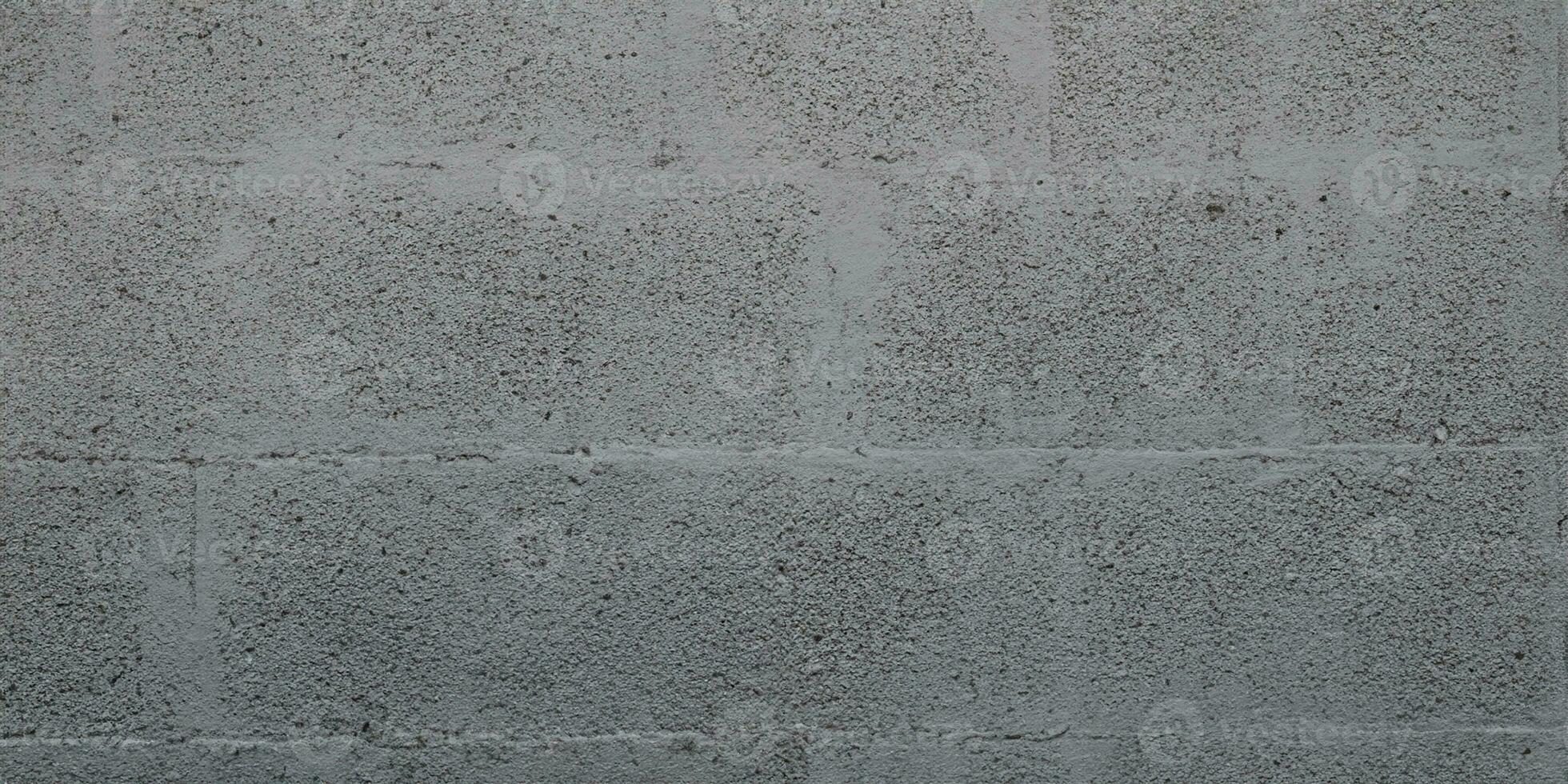 grau Betonblock Backstein Mauer zum Hintergrund grau Blockarbeit Textur foto