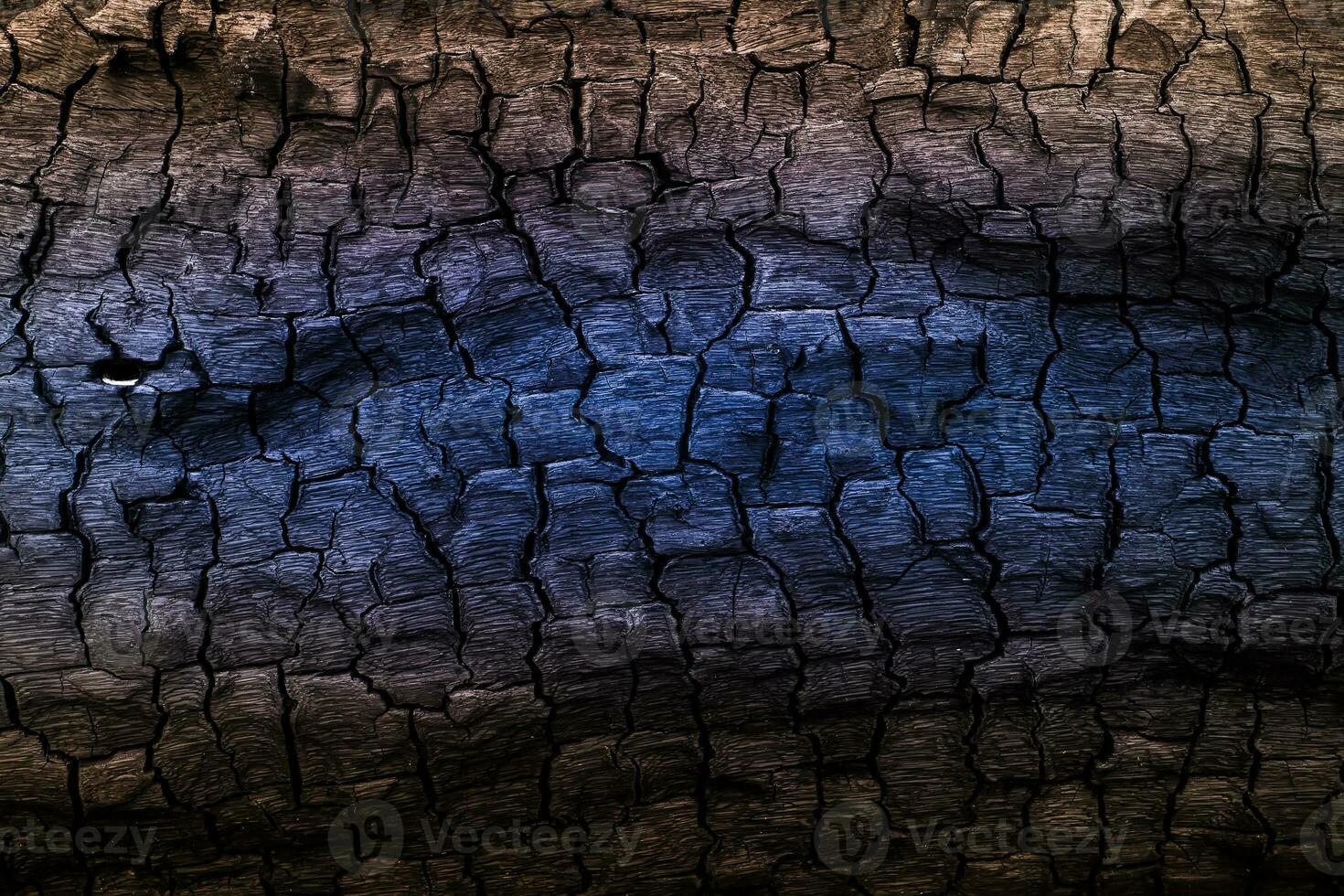 Einzelheiten das Oberfläche von braun und Blau Holzkohle. foto