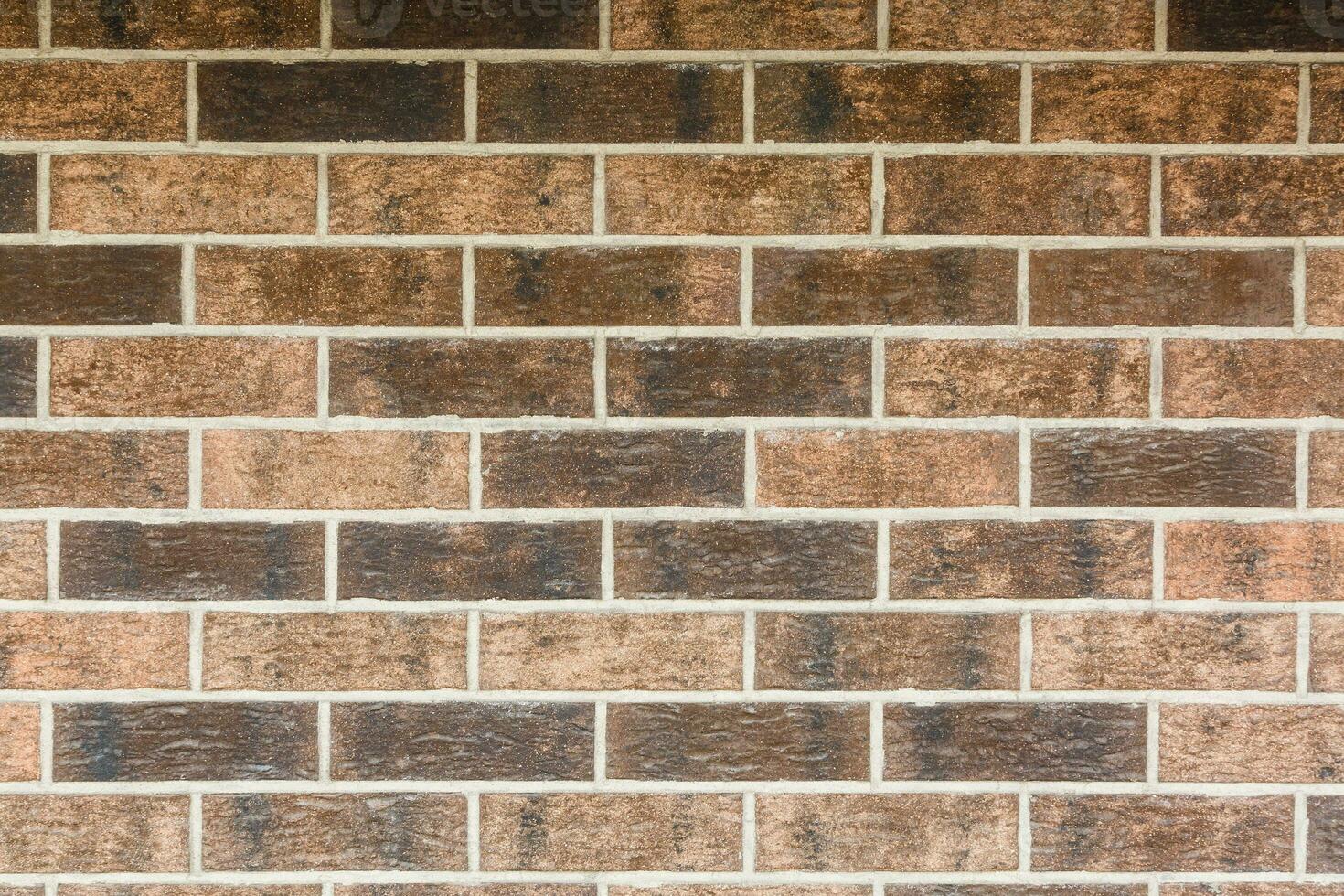 Red Brick Wall Textur Grunge-Hintergrund mit vignettierten Ecken, kann für die Innenarchitektur verwendet werden foto