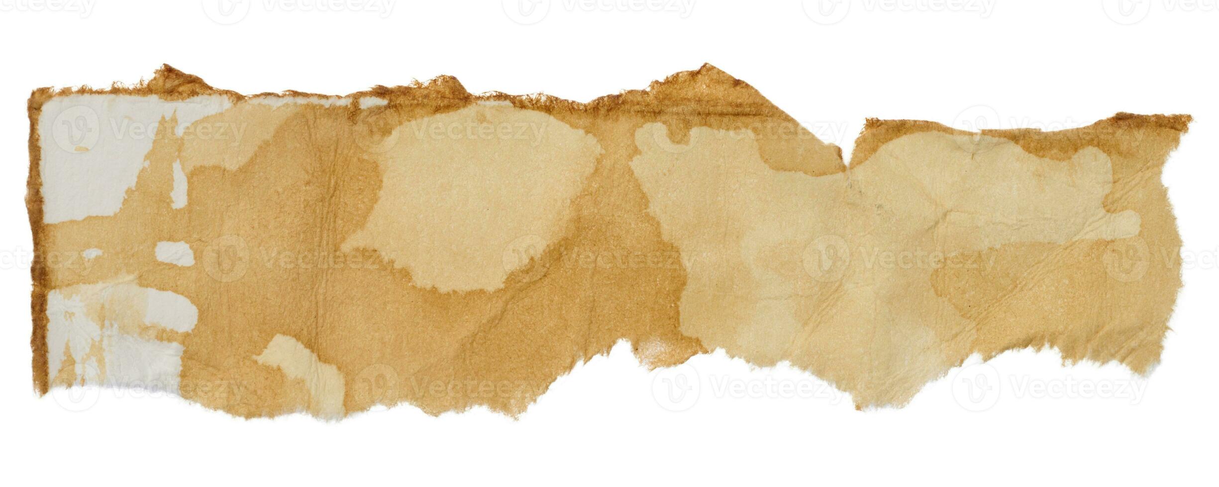 Weiß zerrissen Stück von Papier durchnässt im Kaffee foto