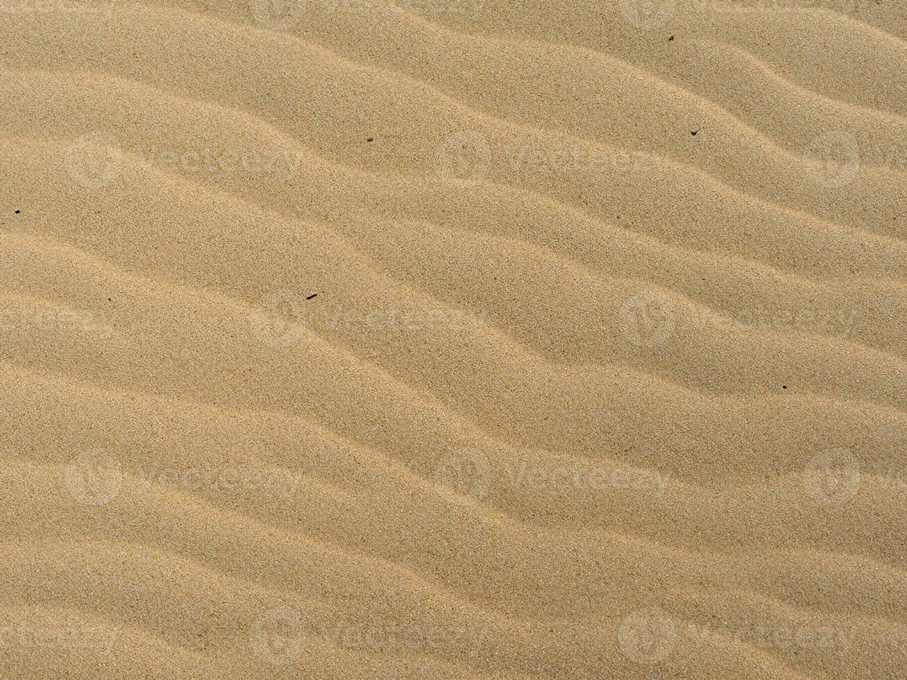 Sandbeschaffenheit. Sandstrand für den Hintergrund. Ansicht von oben foto