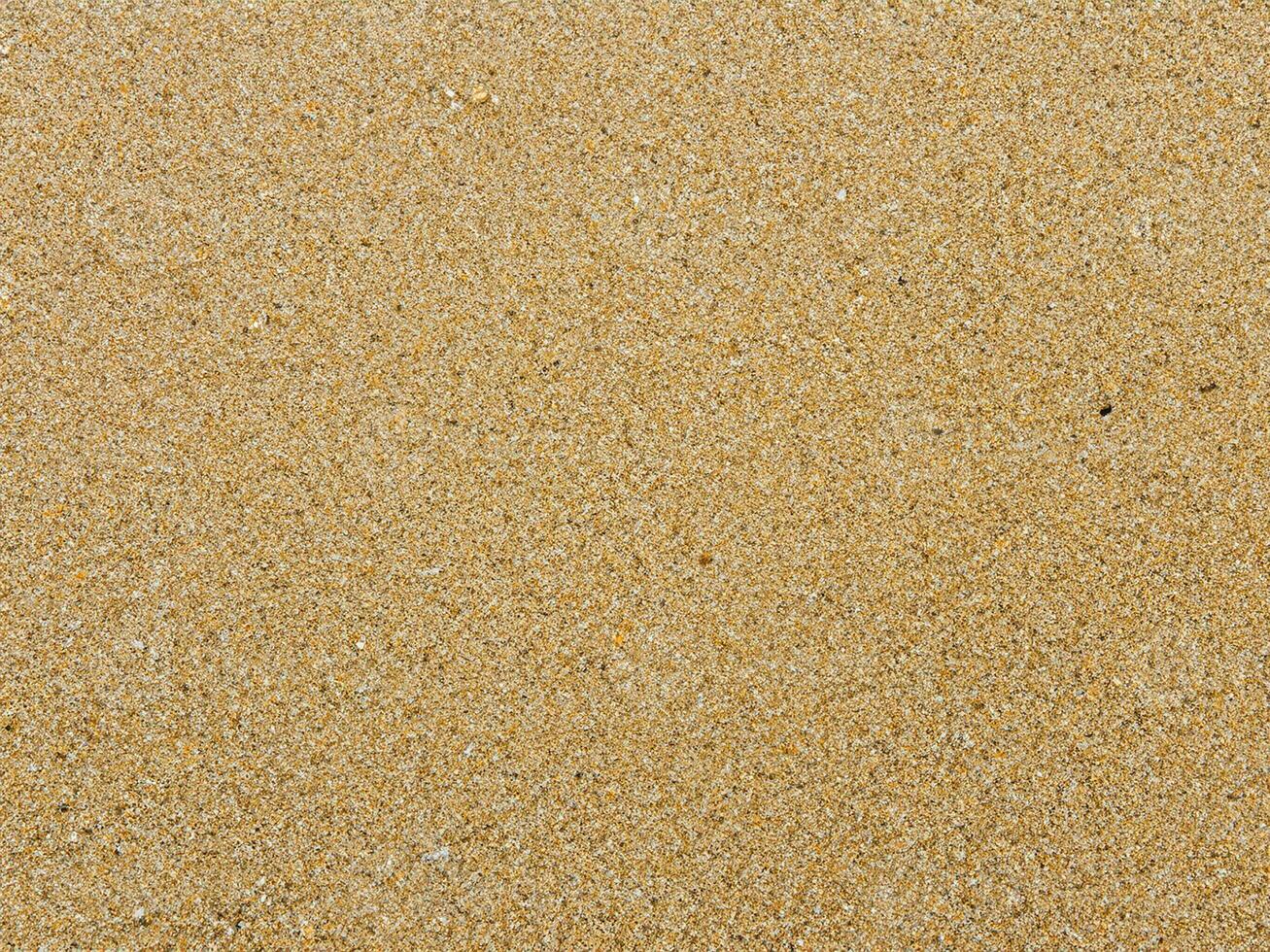 Sandbeschaffenheit. Sandstrand für den Hintergrund. Ansicht von oben foto