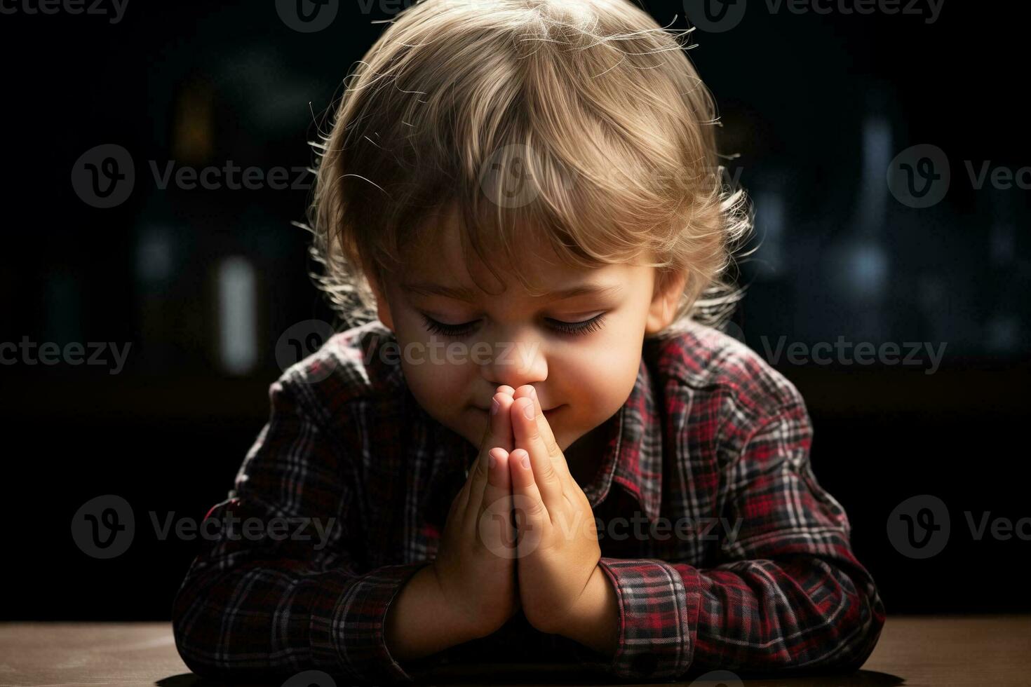 ai generiert ein jung Kind ist beten im Vorderseite von ein Tabelle foto