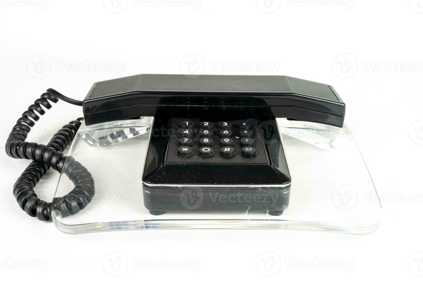schwarz und transparent Jahrgang Telefon Über ein Weiß Hintergrund foto
