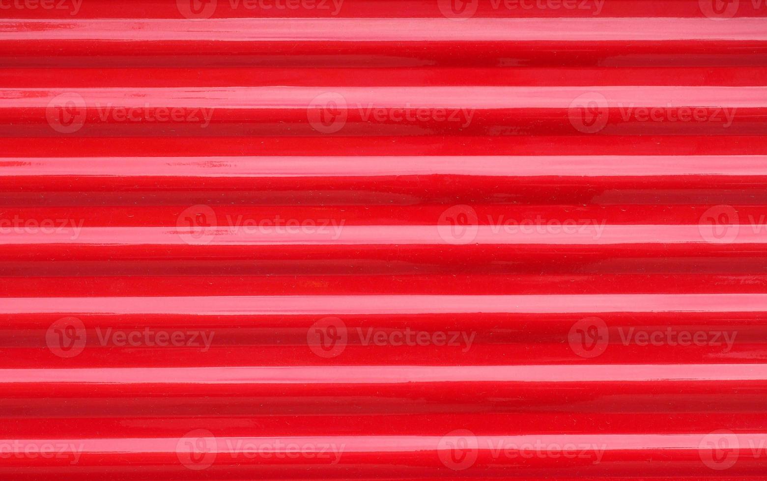 roter gewellter Stahlmetallbeschaffenheitshintergrund foto