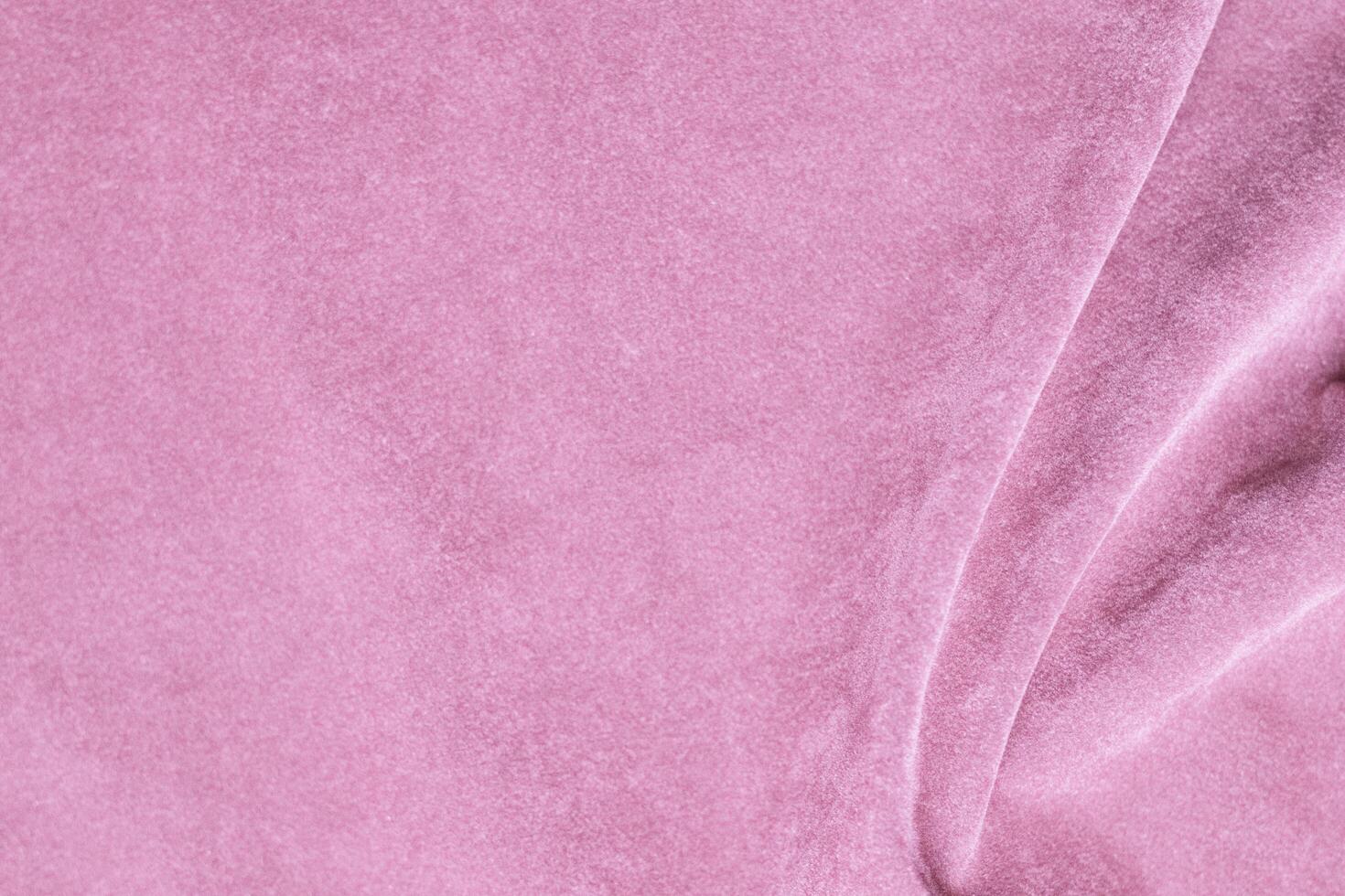 Licht Rosa Samt Stoff Textur benutzt wie Hintergrund. Seide Farbe Sakura Stoff Hintergrund von Sanft und glatt Textil- Material. zerquetscht Samt .Luxus Kirsche blühen Licht Ton zum Seide. foto