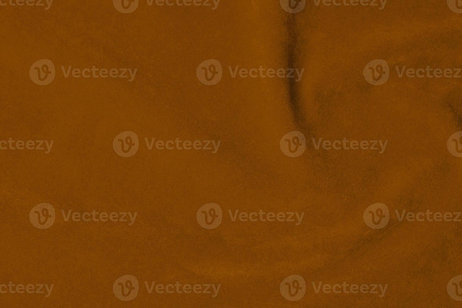 Licht Orange Samt Stoff Textur benutzt wie Hintergrund. Seide Farbe Safran Stoff Hintergrund von Sanft und glatt Textil- Material. zerquetscht Samt .Luxus Sonne Licht Ton zum Seide. foto