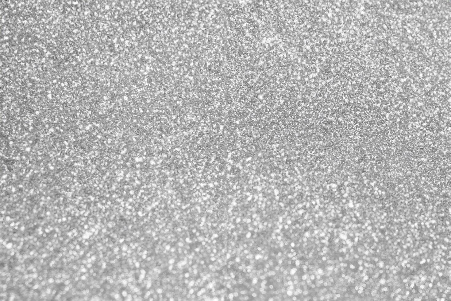 Abstrakte Unschärfe Silberglitter funkeln defokussierter Bokeh-Lichthintergrund foto