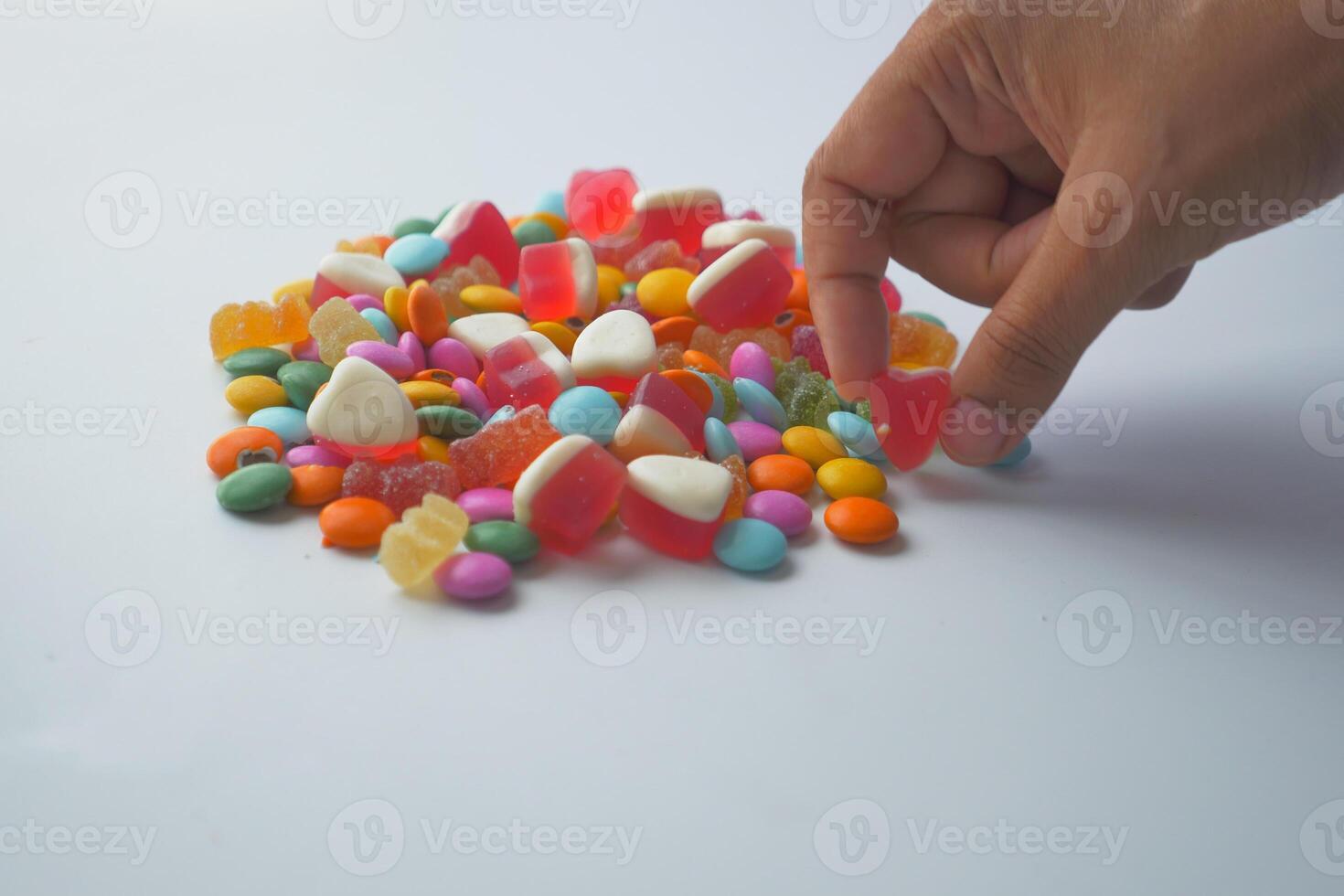 Hand wählen Süßigkeiten Süss Gelee foto