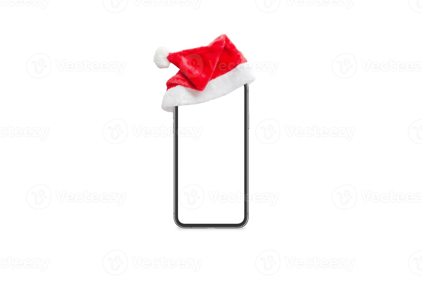 isoliertes Telefonmodell mit Weihnachtsmann-Hut foto